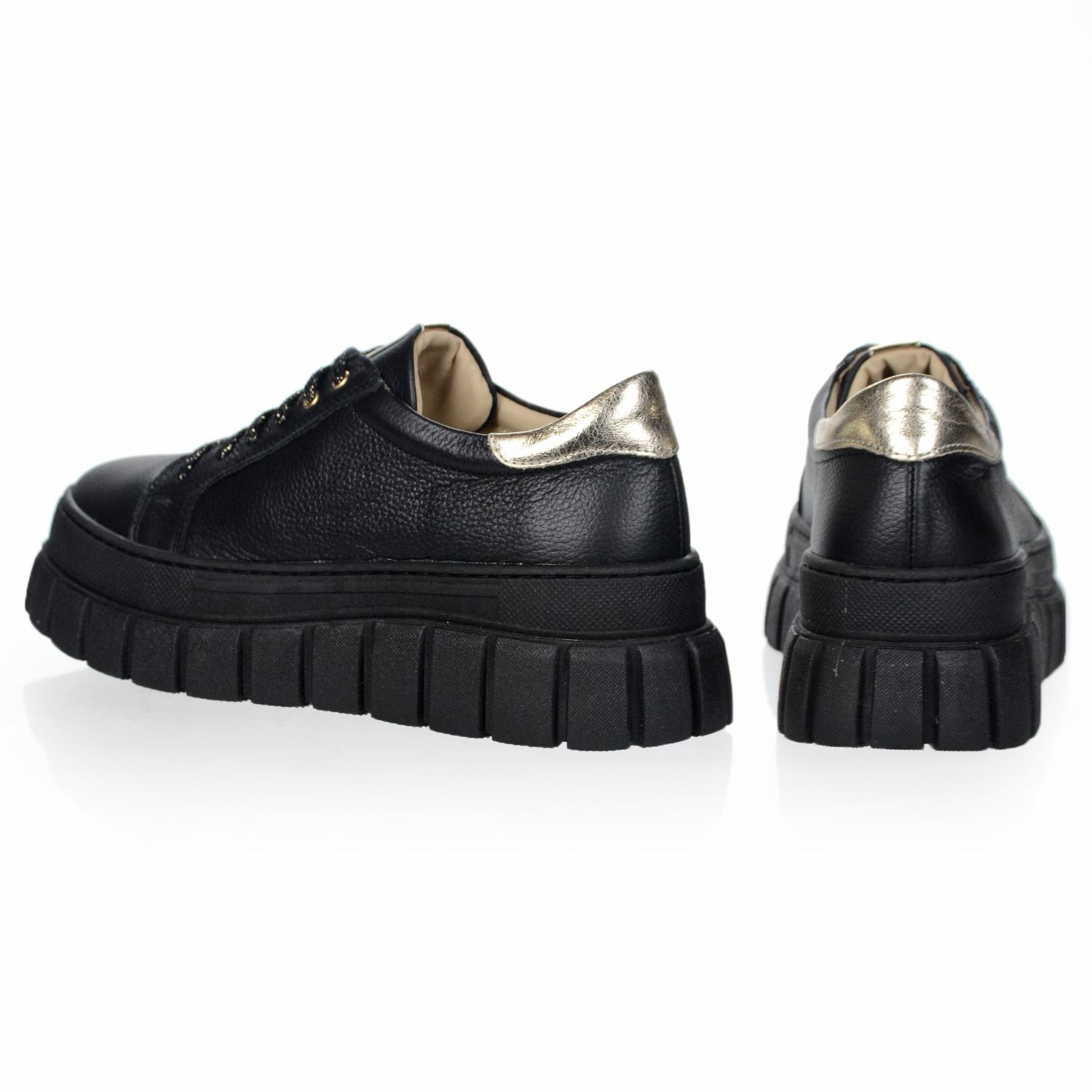 OLIVIA SHOES čierne kožené tenisky zdobené zlatým pásikom na podošve Zuma 